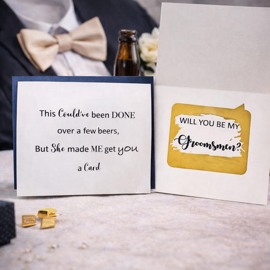 Two cards on a table with a bottle of beer and bow tie in the background.
