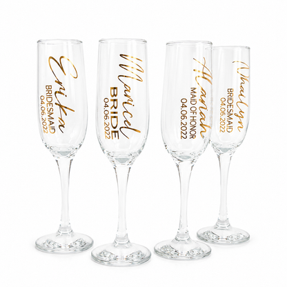 Four champagne flutes with personalized text in gold on a white background