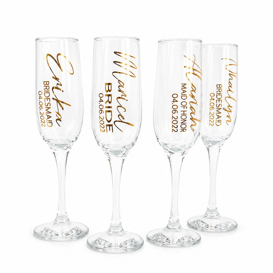 Four champagne flutes with personalized text in gold on a white background