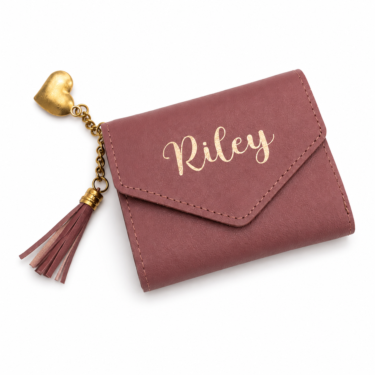 Pink wallet with 'Riley' engraving and gold heart charm on a white background