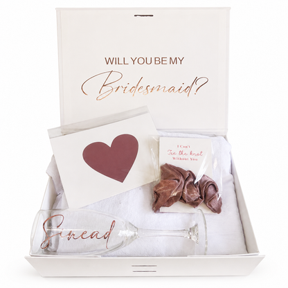 Gift set with 'Will You Be My Bridesmaid?' card, heart-shaped card, and personalized glass in a box.