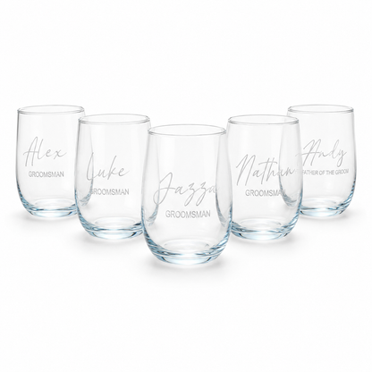 Set of five clear glasses with personalized names on a white background