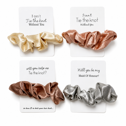 Set of four metallic scrunchies on cards with romantic messages.