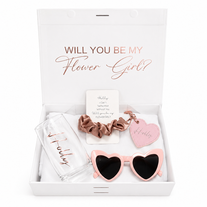 Gift set with 'Will You Be My Flower Girl?' card, sunglasses, scrunchie, and keychain in a box.
