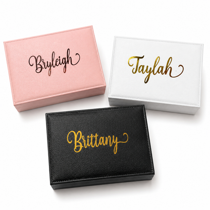 Three personalized jewelry boxes with names 'Byleigh', 'Taylah', and 'Brittany' on a white background.