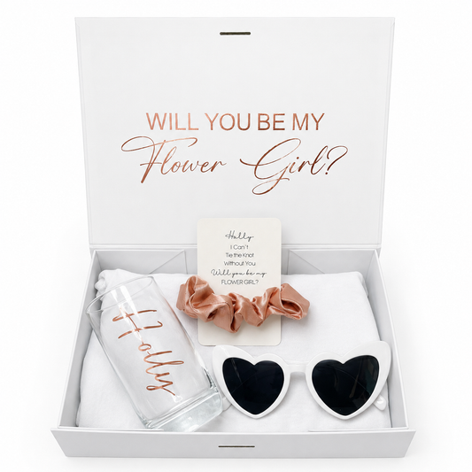 Gift set with 'Will You Be My Flower Girl?' message, sunglasses, scrunchies, and a water bottle in a box.