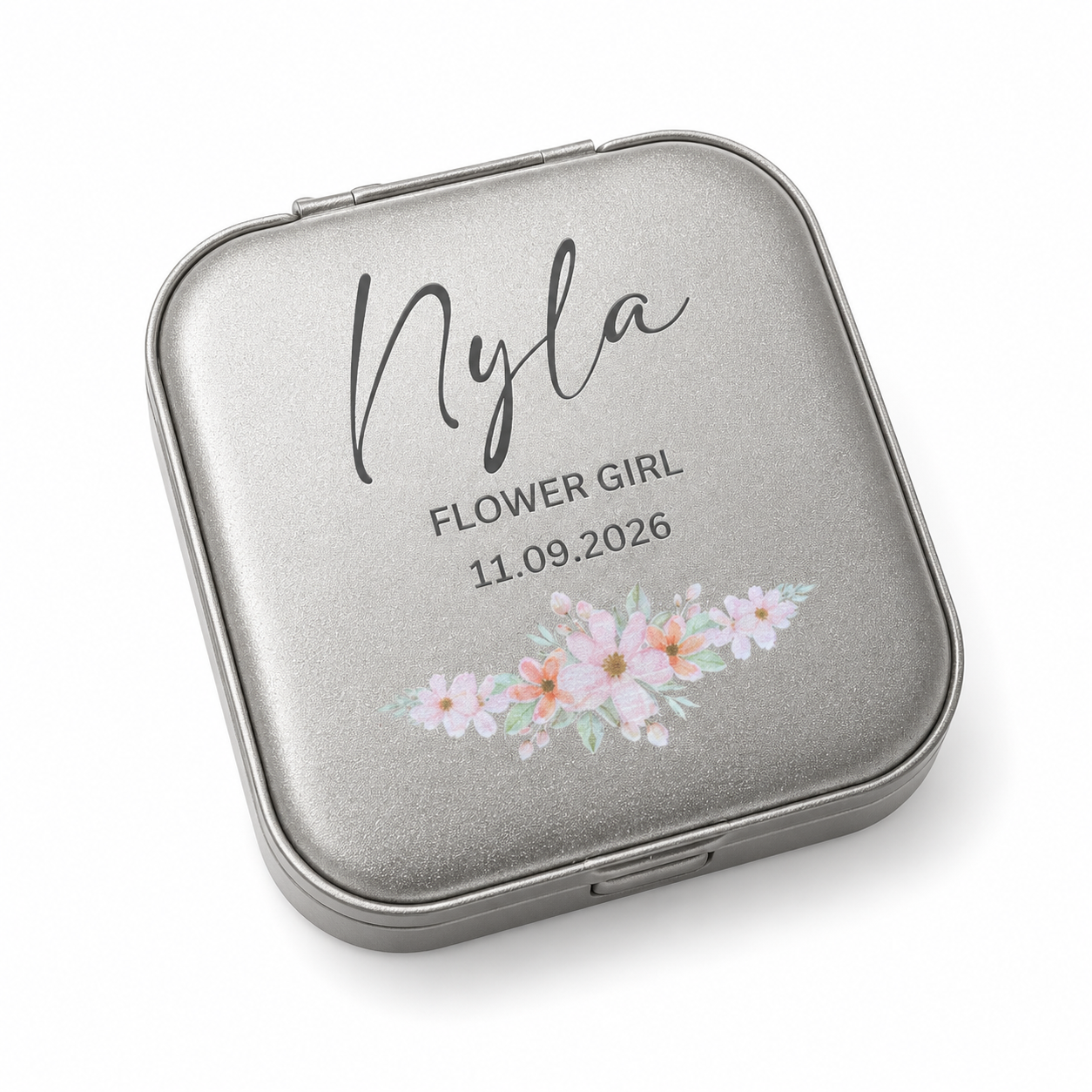 Silver compact mirror with floral design and personalized text on a white background