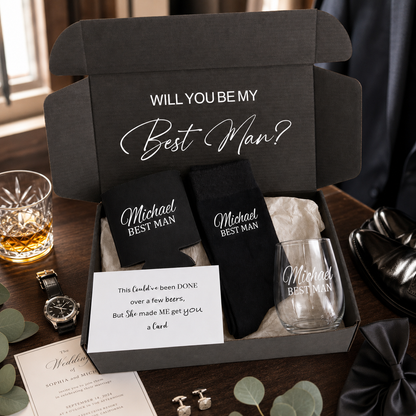 Gift set with 'Will You Be My Best Man?' proposal in a box, including socks, glass, and card.