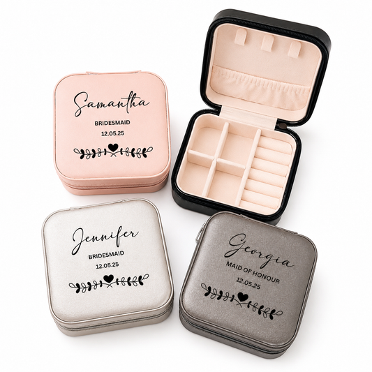 Three jewelry boxes with personalized names and dates on a white background