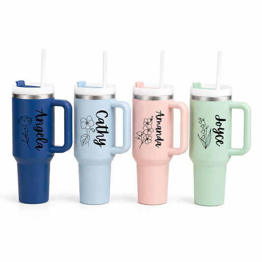 Four insulated travel mugs with handles and straws, each personalized with a name.