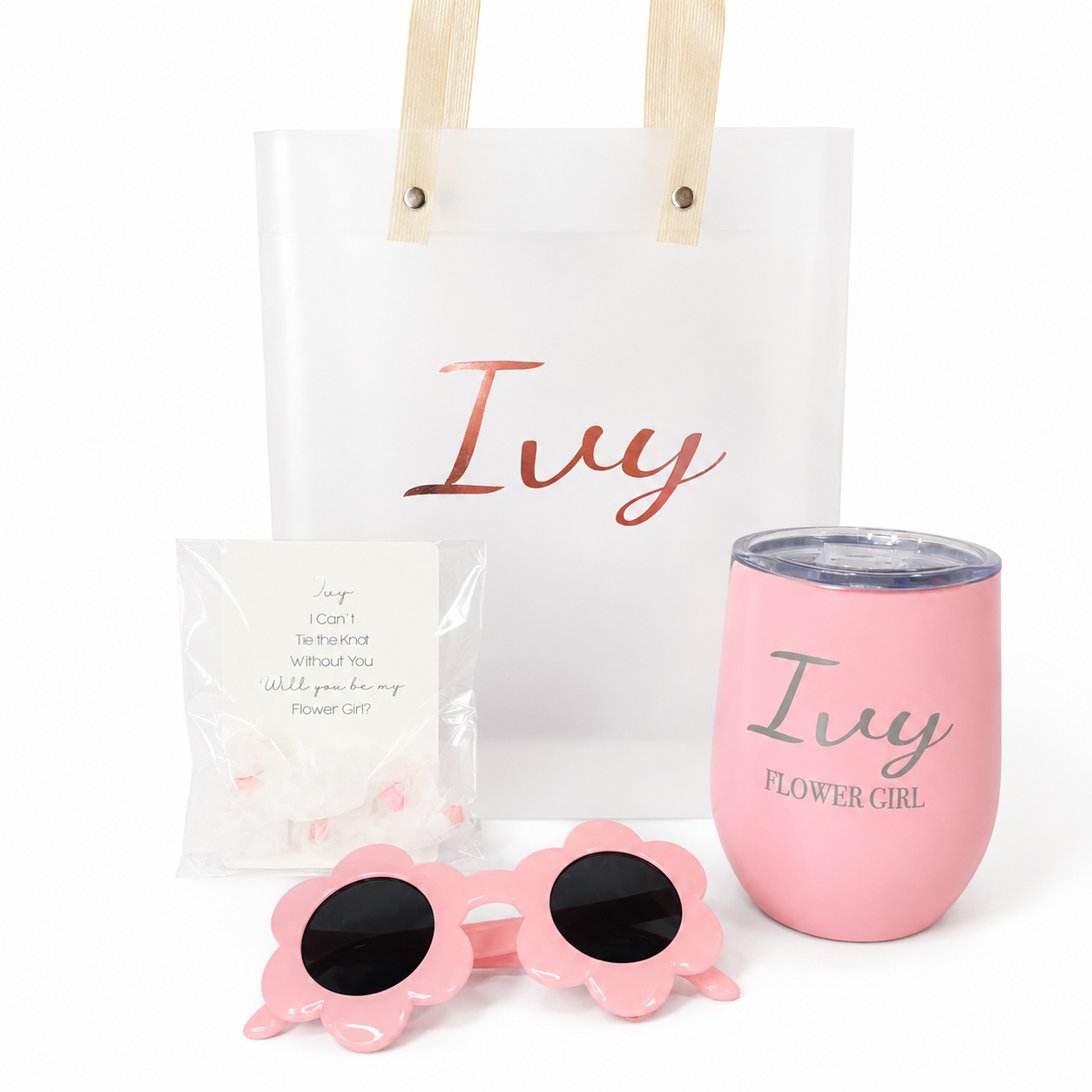 Pink sunglasses, pink tumbler with 'Ivy Flower Girl' text, and white tote bag with 'Ivy' text on a white background.