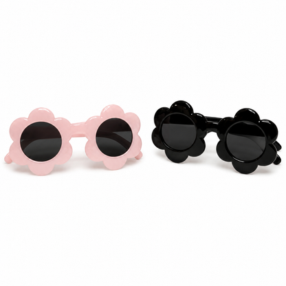 Two pairs of sunglasses with flower-shaped frames, one pink and one black, on a white background.