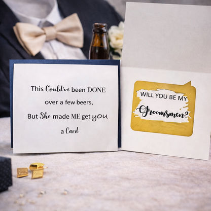 Two cards on a table with a bottle of beer and bow tie in the background.