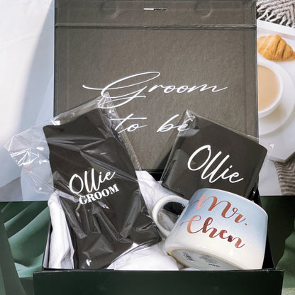 A gift box for the groom, with personalized text on the inside and outside of the box, including a black stubby holder, a pair of personalized socks, and a mug with 'MR. CHEN' written on it.