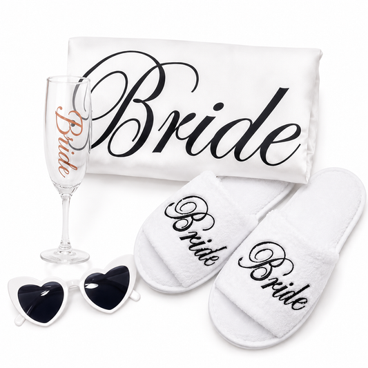 Bride-themed items including a glass, towel, slippers, and sunglasses on a white background.