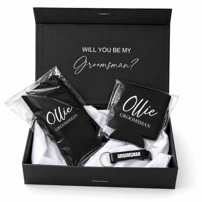 Groomsmen gift set with black pouches, coasters, and keychain in a box.