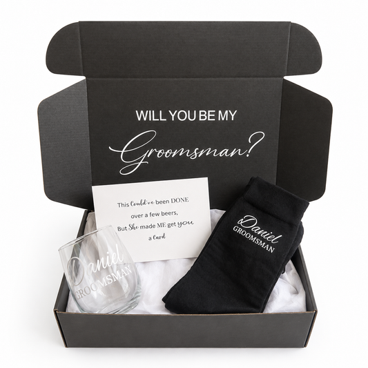 Groomsmen proposal box with glass, socks, and card inside
