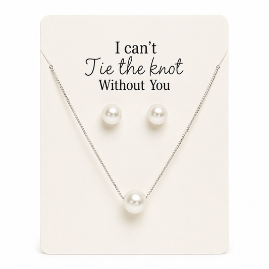 Pearl necklace and earrings set on a card with 'I can't tie the knot without you' text.