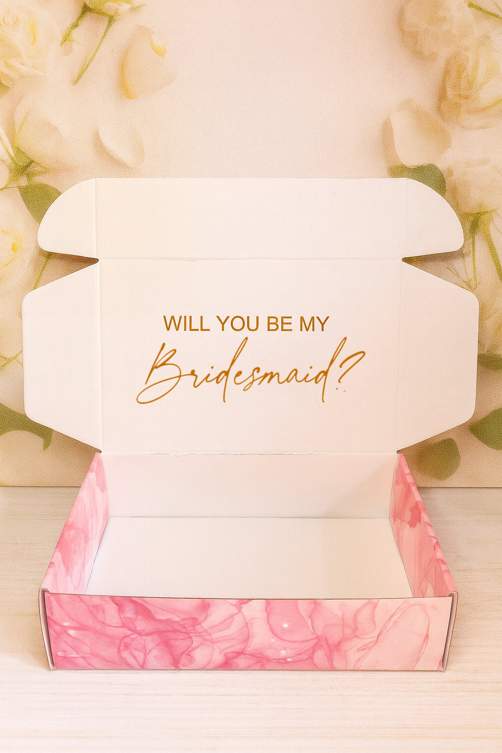 Open box with 'Will you be my Bridesmaid?' text on a floral background