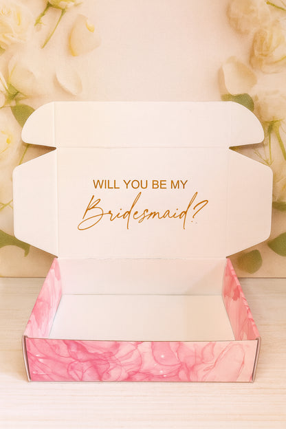 Open box with 'Will you be my Bridesmaid?' text on a floral background