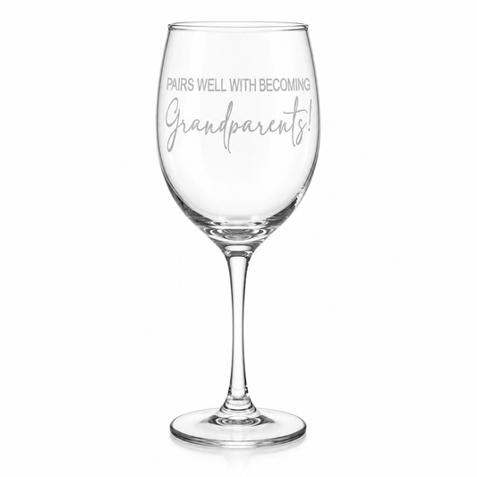 Clear wine glass with text 'Pairs Well With Becoming Grandparents' on a white background