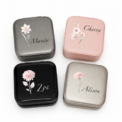 Four small jewelry boxes with floral designs and names on a white background