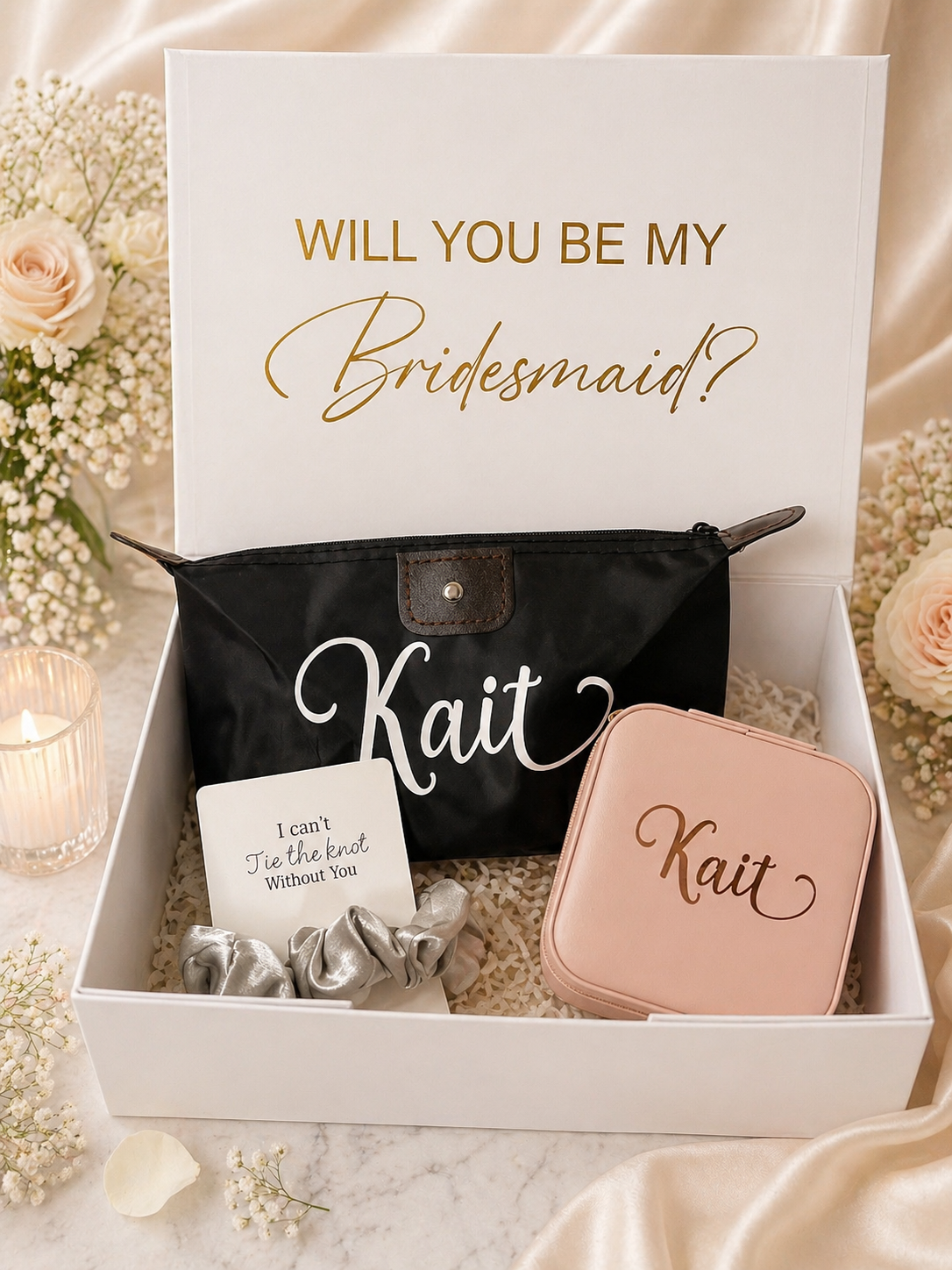 Gift set with 'Will you be my Bridesmaid?' card, black pouch, and pink case on a marble surface.