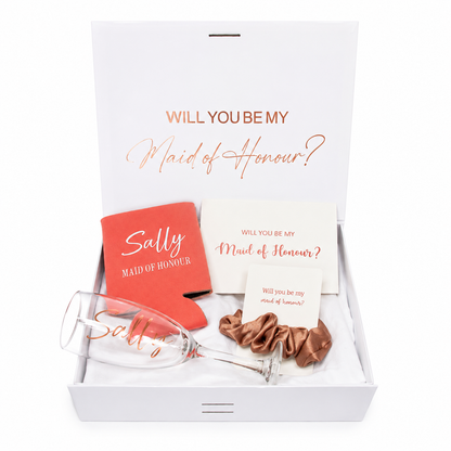 Gift set with 'Will you be my Maid of Honour?' card, wine glass, and scrunchie in a box.