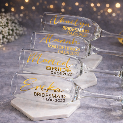 Set of personalized wine glasses with names and dates on a decorative background