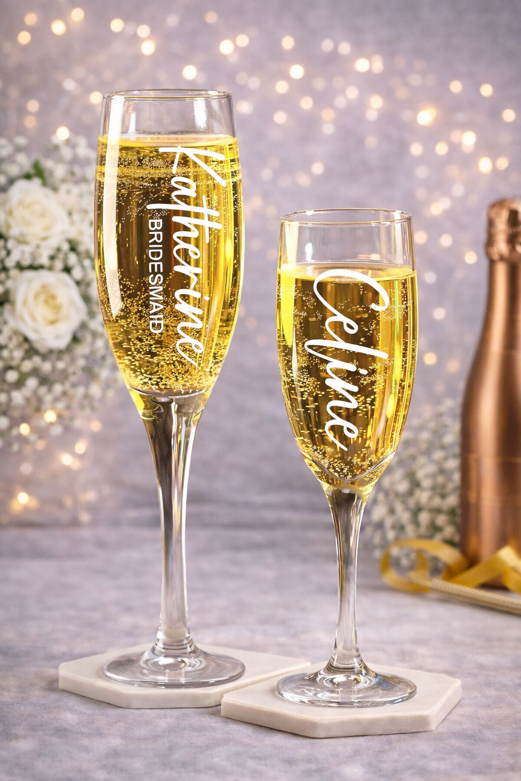 Two champagne flutes with personalized names on a decorative background