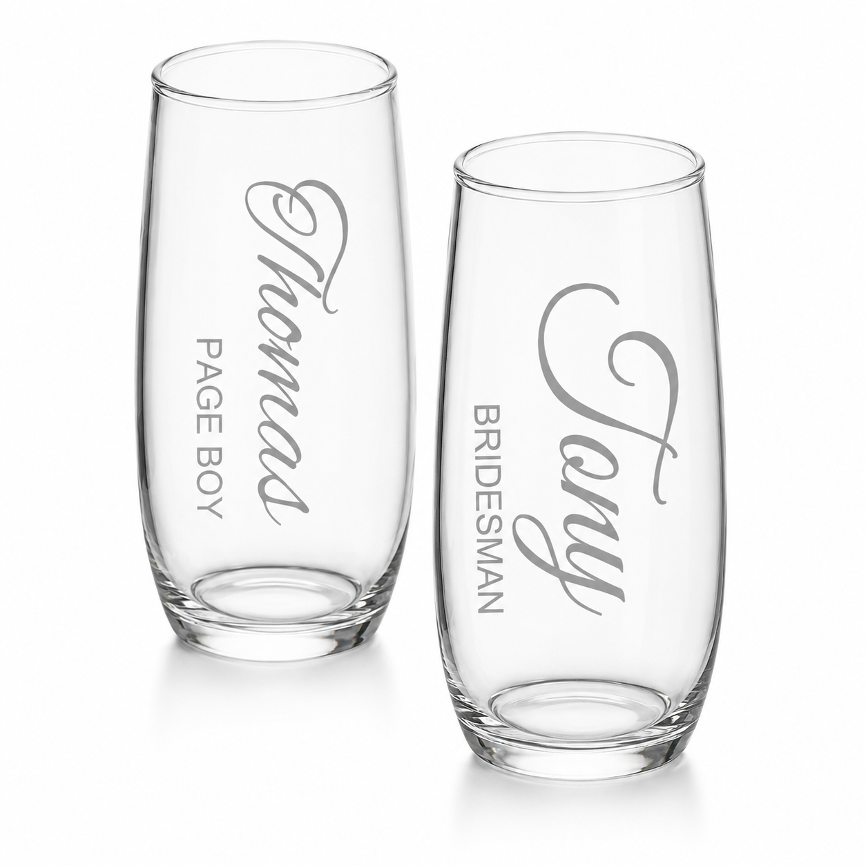 Two clear glasses with engraved names on a white background