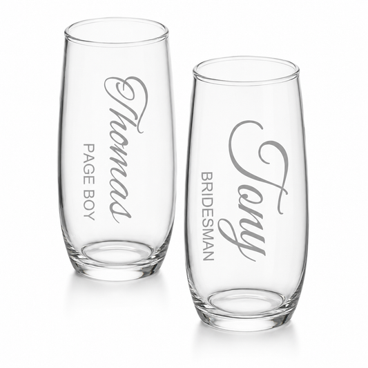 Two clear glasses with engraved names on a white background