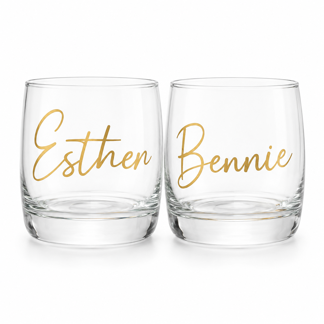 Two clear glasses with gold names 'Esther' and 'Bennie' on a white background