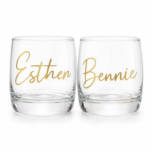Two clear glasses with gold names 'Esther' and 'Bennie' on a white background