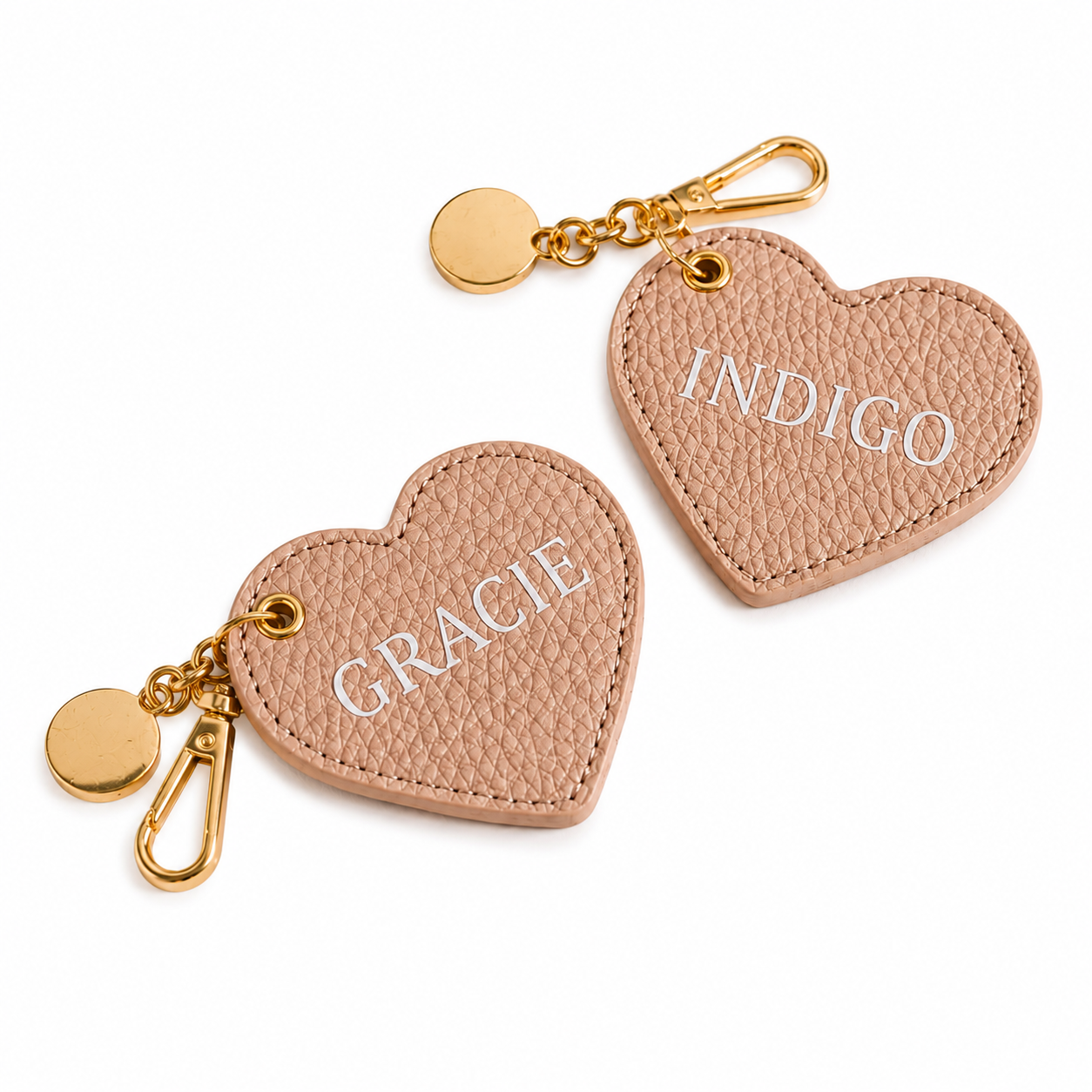 Heart-shaped keychains with 'Gracie' and 'Indigo' text on a white background