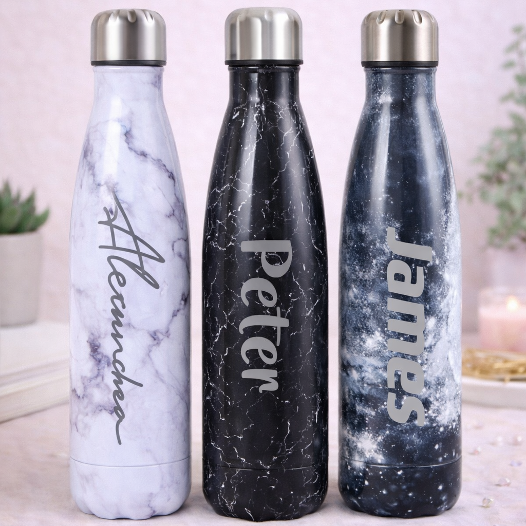 Three marble-textured water bottles with names 'Alexandra', 'Peter', and 'James' on a light background.
