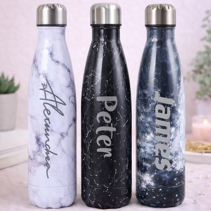 Three marble-textured water bottles with names 'Alexandra', 'Peter', and 'James' on a light background.