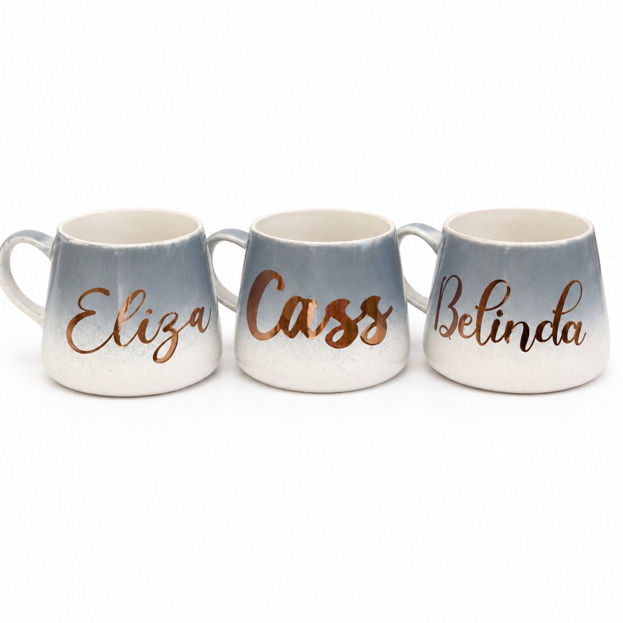 Three mugs with names 'Eliza', 'Cass', and 'Belinda' on a white background