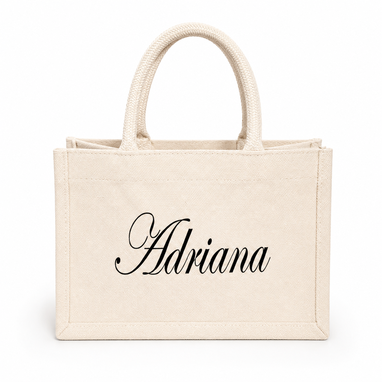 Beige tote bag with 'Adriana' printed on a white background