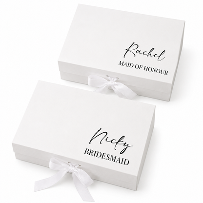 Two white gift boxes with personalized names on a white background
