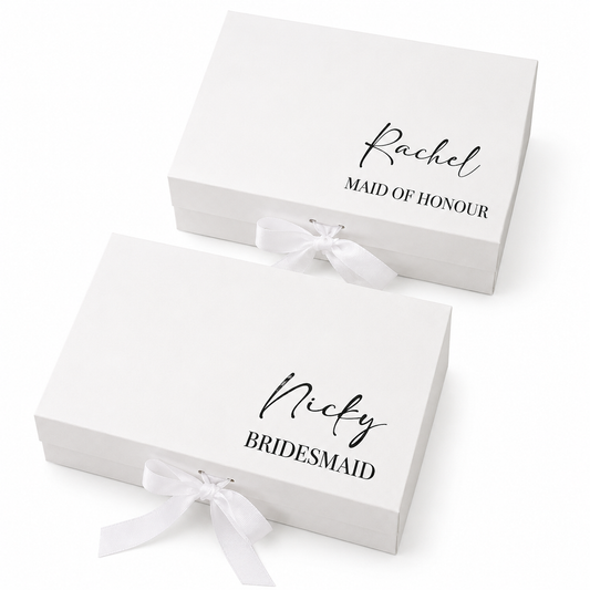 Two white gift boxes with personalized names on a white background