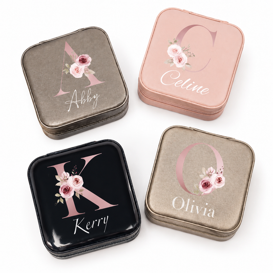 Four personalized jewelry boxes with floral designs and names on a white background