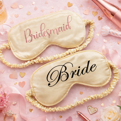 Two sleep eye masks labeled 'Bride' and 'Bridesmaid' on a pink background with flowers and party favors.