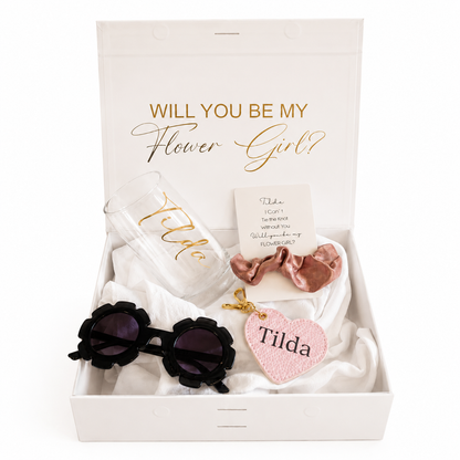 Gift set with sunglasses, hair accessories, and card in a box with 'Will you be my Flower Girl?' text.